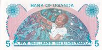 Uganda 5 Shillings - Building - Young woman - 1979 - Serial A.86 - P.10